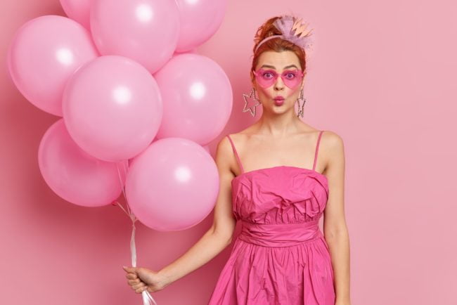 Photo of glamour woman likes pink color wears trendy sunglasses fashionable dress prefers style of n
